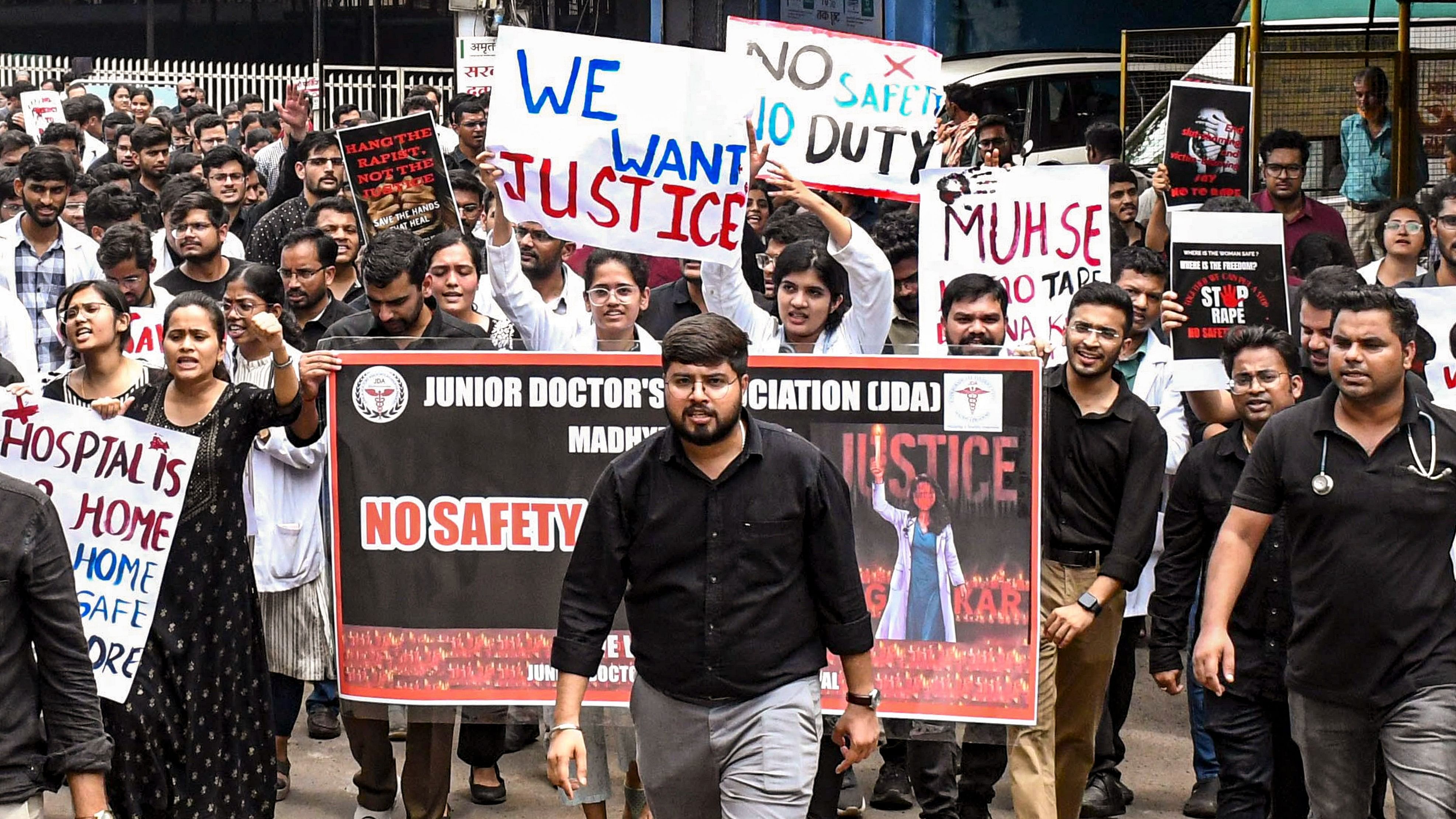 <div class="paragraphs"><p>Doctors of Hamidia Hospital take part in a protest rally against the alleged rape and murder of a woman doctor at Kolkata's R G Kar Medical College and Hospital, in Bhopal, Friday.</p></div>